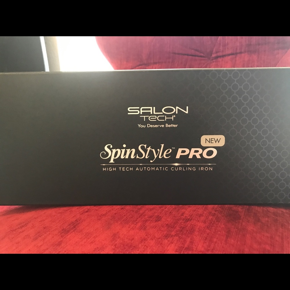 Spinning curling iron